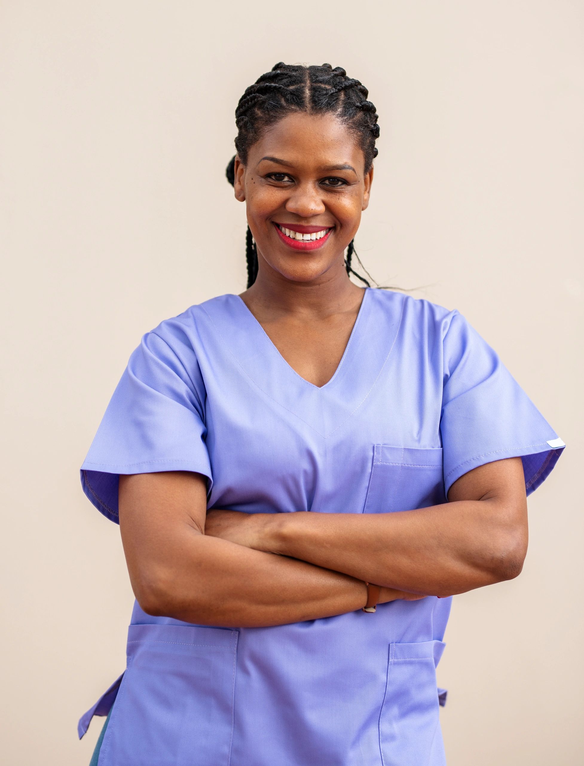Female physical therapy professional smiling in a clinic setting